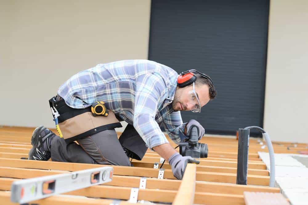 man building a deck