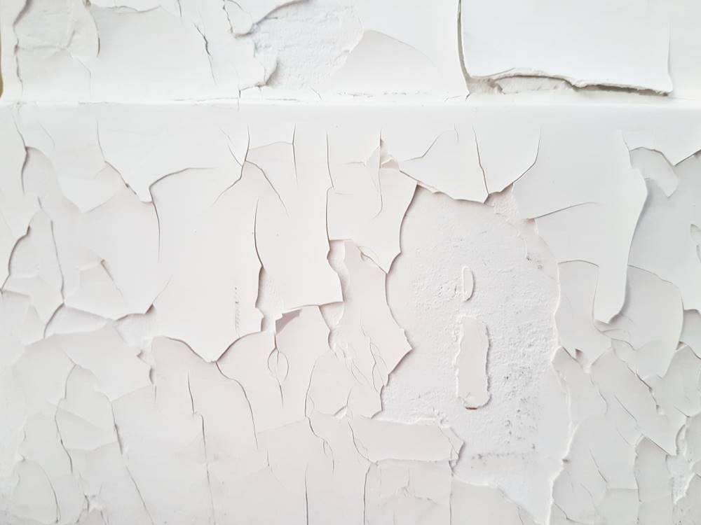 white wall peeling