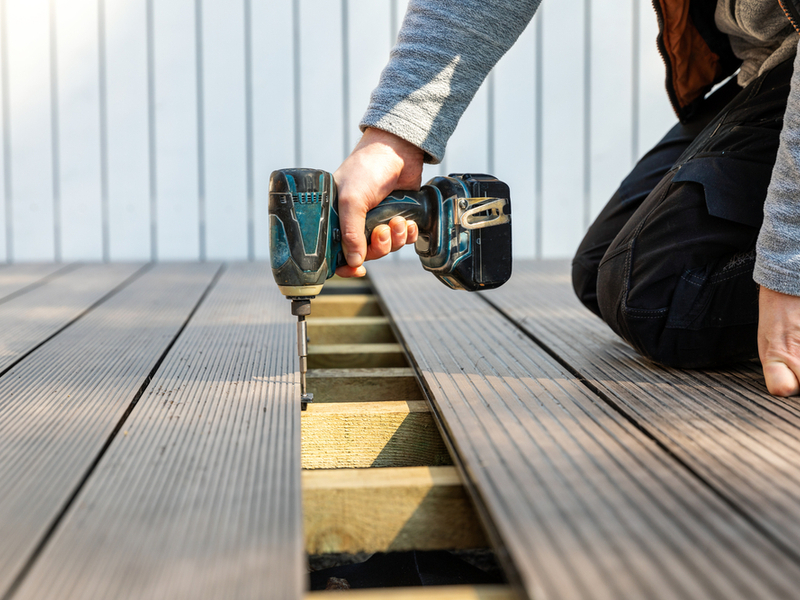 man installing deck