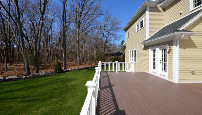 Large composite deck on colonial style house